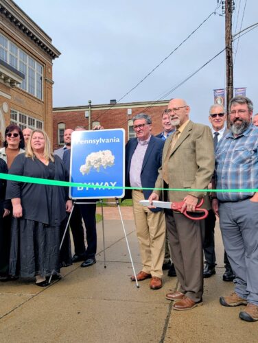 Photos submitted to the Times Observer Warren County Commissioner Dan Glotz, who is also the PA Route 6 Alliance board president, prepares to cut the ribbon on the Route 6 Scenic Byway in Coudersport.